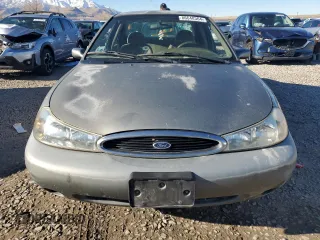1998 Ford Contour z VIN 1FAFP66Z5WK232756, wystawiony jako Copart lot #86648364 z przebiegiem 118 176 mil mil oraz Tytuł czysty. Historia ofert i sprzedaży dostępna na DreamBid. Obrazek 5.