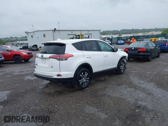 2018 Toyota RAV4 LE with VIN 2T3BFREV7JW851015, listed as a IAAI auction lot 42354042 with 94,603 mi miles and . Bid and sale history available at DreamBid. Image 4.