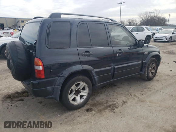 2003 Suzuki Grand Vitara z VIN JS3TE62V834101506, wystawiony jako Copart lot #47094765 z przebiegiem 240 778 mil mil oraz Szkoda całkowita • Salvage title. Historia ofert i sprzedaży dostępna na DreamBid. Obrazek 3.