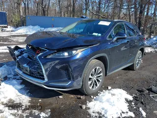 2021 Lexus RX with VIN 2T2HZMDA4MC277227, listed as a IAAI auction lot 41527380 with 52,580 mi miles. Bid and sale history available at carsss.com. Image 2.