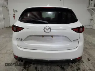 2021 Mazda CX-5 Grand Touring with VIN JM3KFBDM4M1344602, listed as a Copart auction lot 82793724 with 69,322 mi miles and Salvage Title. Bid and sale history available at carsss.com. Image 6.