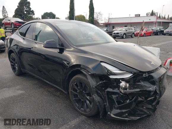 2023 Tesla Model Y Long Range with VIN 7SAYGDEE2PA024032, listed as a IAAI auction lot 41213403 with 23,418 mi miles and . Bid and sale history available at DreamBid. Image 13.