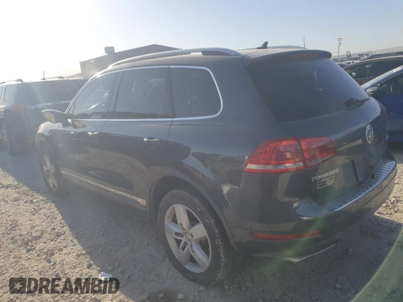 2012 Volkswagen Touareg Sport z VIN WVGFK9BP6CD001309, wystawiony jako Copart lot #52827875 z przebiegiem 153 250 mil mil oraz Czysty tytuł • Clean title. Historia ofert i sprzedaży dostępna na DreamBid. Obrazek 2.