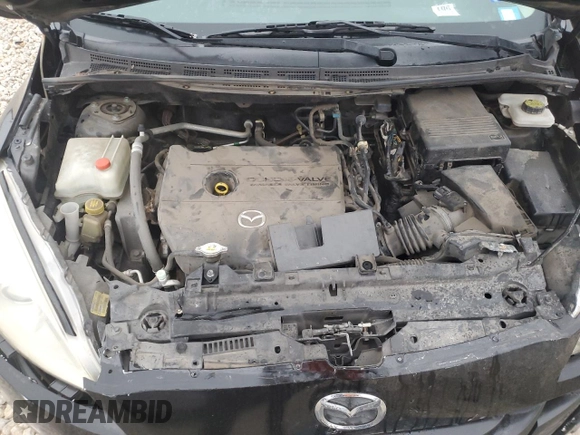 2012 Mazda 5 Sport z VIN JM1CW2BL0C0142657, wystawiony jako Copart lot #85156244 z przebiegiem 107 628 mil mil oraz Szkoda całkowita • Salvage title. Historia ofert i sprzedaży dostępna na DreamBid. Obrazek 11.
