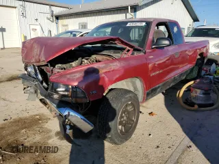 1999 Dodge Dakota SLT z VIN 1B7GL22X6XS165559, wystawiony jako Copart lot #42640735 z przebiegiem 170 219 mil mil oraz Szkody całkowita. Historia ofert i sprzedaży dostępna na DreamBid. Obrazek 1.