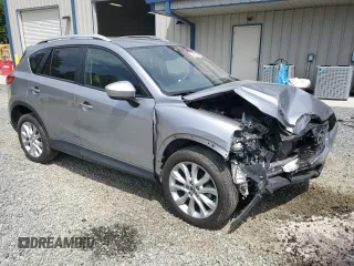 2014 Mazda CX-5 Grand Touring with VIN JM3KE4DY9E0416967, listed as a Copart auction lot 54215285 with 77,296 mi miles and Salvage Title. Bid and sale history available at DreamBid. Image 4.