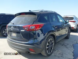 2016 Mazda CX-5 Grand Touring z VIN JM3KE2DY3G0797321, wystawiony jako IAAI lot #42017174 z przebiegiem 65 505 mil mil oraz . Historia ofert i sprzedaży dostępna na DreamBid. Obrazek 4.