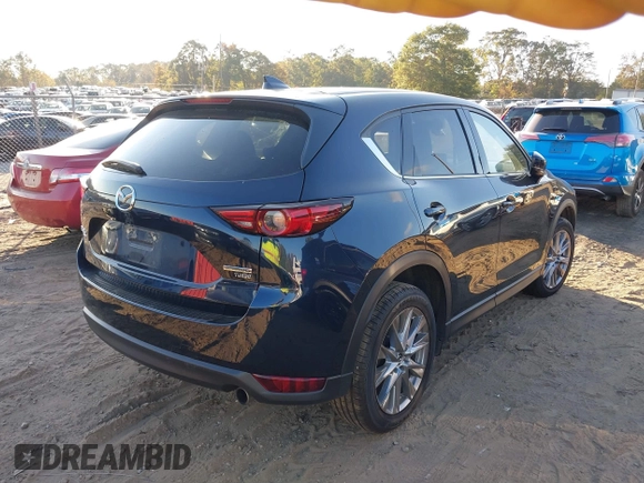 2021 Mazda CX-5 Grand Touring Reserve with VIN JM3KFBAYXM0465762, listed as a IAAI auction lot 40728368 with 30,667 mi miles. Bid and sale history available at carsss.com. Image 4.
