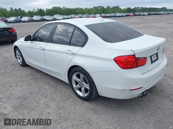 2015 BMW 3 Series 328i with VIN WBA3A5C50FF608327, listed as a IAAI auction lot 42136156 with 213,945 mi miles. Bid and sale history available at carsss.com. Image 3.