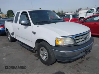2001 Ford F-150 XL with VIN 1FTRX07L91KA77460, listed as a IAAI auction lot 41686519 with 185,286 mi miles. Bid and sale history available at carsss.com. Image 1.