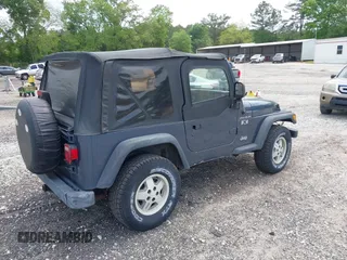2002 Jeep Wrangler X with VIN 1J4FA39S92P736825, listed as a IAAI auction lot 42156410 with 196,313 mi miles. Bid and sale history available at carsss.com. Image 4.