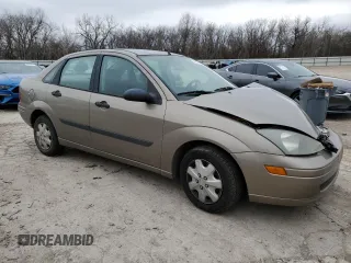 2003 Ford Focus LX with VIN 1FAFP33P73W114861, listed as a Copart auction lot 44859405 with 100,574 mi miles and Salvage Title. Bid and sale history available at carsss.com. Image 4.
