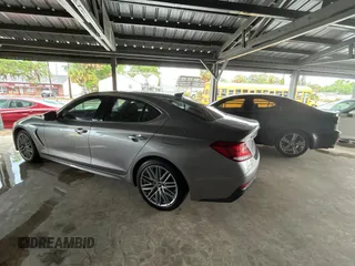 2021 Genesis G70 2.0T z VIN KMTG34LAXMU074866, wystawiony jako Copart lot #56966995 z przebiegiem 54 000 mil mil oraz Tytuł czysty. Historia ofert i sprzedaży dostępna na DreamBid. Obrazek 3.