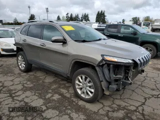 2017 Jeep Cherokee Limited with VIN 1C4PJMDSXHW633757, listed as a Copart auction lot 52146435 with 104,066 mi miles and Salvage Title. Bid and sale history available at DreamBid. Image 4.