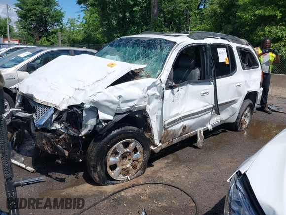 2003 GMC Envoy SLT z VIN 1GKES16S136235222, wystawiony jako IAAI lot #42245115 z przebiegiem Nie podano mil oraz . Historia ofert i sprzedaży dostępna na DreamBid. Obrazek 2.