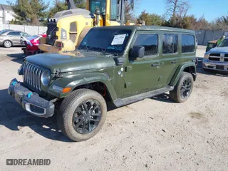 2022 Jeep Wrangler 4xe Unlimited Sahara with VIN 1C4JJXP69NW228829, listed as a IAAI auction lot 41677314 with 20,084 mi miles. Bid and sale history available at carsss.com. Image 2.
