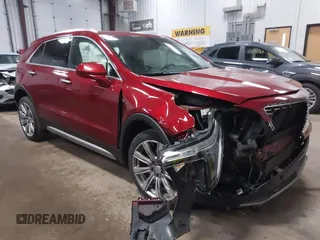 2019 Cadillac XT4 AWD Premium Luxury z VIN 1GYFZDR47KF212952, wystawiony jako IAAI lot #42067428 z przebiegiem 121 053 mil mil oraz . Historia ofert i sprzedaży dostępna na DreamBid. Obrazek 1.
