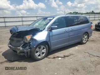 2010 Honda Odyssey Touring with VIN 5FNRL3H94AB077220, listed as a Copart auction lot 64694335 with 213,456 mi miles and Salvage title. Bid and sale history available at DreamBid. Image 1.