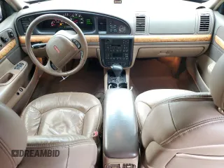 1999 Lincoln Continental with VIN 1LNHM97V3XY667567, listed as a Copart auction lot 84194854 with 137,163 mi miles and Salvage Title. Bid and sale history available at carsss.com. Image 8.