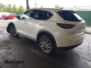 2019 Mazda CX-5 Grand Touring with VIN JM3KFBDMXK0648813, listed as a IAAI auction lot 42524680 with 23,521 mi miles and . Bid and sale history available at DreamBid. Image 3.