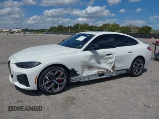 2024 BMW i4 eDrive35 z VIN WBY43AW02RFS79370, wystawiony jako IAAI lot #41887964 z przebiegiem 11 910 mil mil oraz . Historia ofert i sprzedaży dostępna na DreamBid. Obrazek 21.