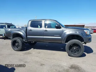 2014 Toyota Tacoma PreRunner with VIN 3TMJU4GN3EM165840, listed as a IAAI auction lot 41666871 with 150,333 mi miles and . Bid and sale history available at DreamBid. Image 14.