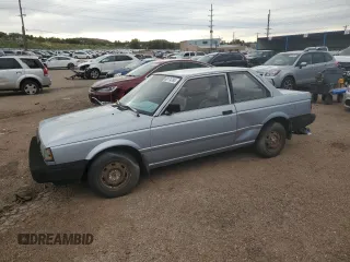 1987 Nissan Sentra z VIN JN1PB2210HU557007, wystawiony jako Copart lot #68174784 z przebiegiem 150 316 mil mil oraz Tytuł czysty. Historia ofert i sprzedaży dostępna na DreamBid. Obrazek 1.
