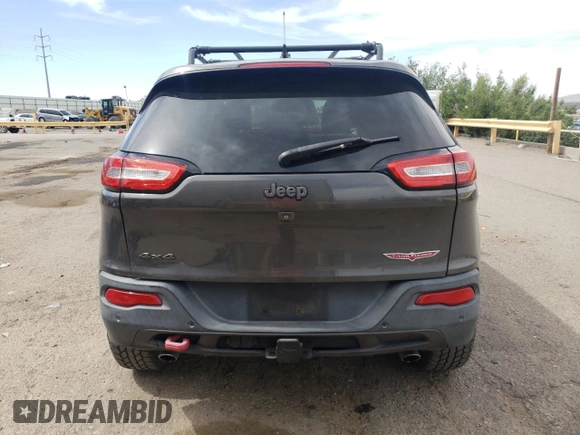 2014 Jeep Cherokee Trailhawk with VIN 1C4PJMBS6EW140981, listed as a Copart auction lot 58260325 with 97,036 mi miles and Salvage title. Bid and sale history available at DreamBid. Image 6.