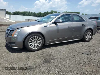 2012 Cadillac CTS Luxury with VIN 1G6DE5E54C0138040, listed as a Copart auction lot 61997305 with 140,996 mi miles and Salvage title. Bid and sale history available at DreamBid. Image 1.