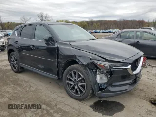 2017 Mazda CX-5 Grand Touring with VIN JM3KFBDL7H0204658, listed as a Copart auction lot 54007165 with 154,546 mi miles and Salvage Title. Bid and sale history available at carsss.com. Image 4.