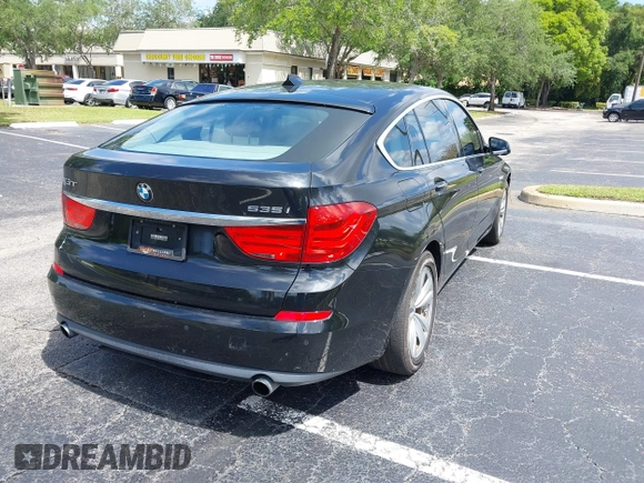 2011 BMW 5 Series GT 535i xDrive with VIN WBASP2C50BC337015, listed as a IAAI auction lot 42209500 with 136,961 mi miles. Bid and sale history available at carsss.com. Image 4.