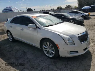 2014 Cadillac XTS Premium with VIN 2G61P5S36E9305491, listed as a Copart auction lot 44404425 with 104,710 mi miles and Salvage Title. Bid and sale history available at DreamBid. Image 4.