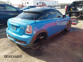 2013 MINI Coupe S with VIN WMWSX3C55DT466604, listed as a IAAI auction lot 42033723 with 109,814 mi miles and . Bid and sale history available at DreamBid. Image 4.