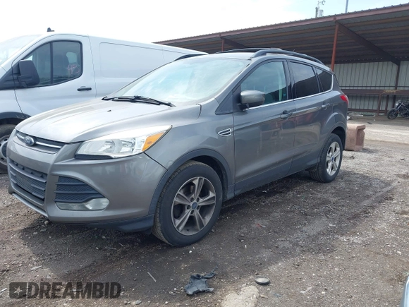 2013 Ford Escape SE with VIN 1FMCU0GX8DUB98700, listed as a IAAI auction lot 42012090 with 221,394 mi miles. Bid and sale history available at carsss.com. Image 2.
