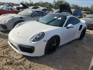 2017 Porsche 911 Turbo S z VIN WP0AD2A96HS166752, wystawiony jako Copart lot #73758584 z przebiegiem Nie podano mil oraz Szkoda całkowita • Salvage title. Historia ofert i sprzedaży dostępna na DreamBid. Obrazek 1.