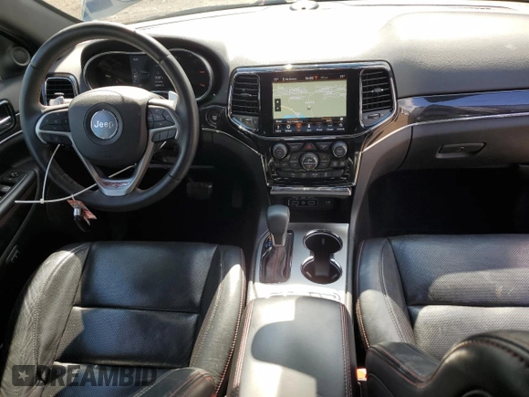 2019 Jeep Grand Cherokee Trailhawk with VIN 1C4RJFLT8KC726784, listed as a Copart auction lot 66010235 with 136,683 mi miles and Salvage title. Bid and sale history available at DreamBid. Image 8.