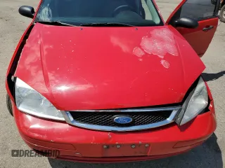 2007 Ford Focus S z VIN 1FAFP34NX7W360015, wystawiony jako Copart lot #57499655 z przebiegiem 237 516 mil mil oraz Szkoda całkowita • Salvage title. Historia ofert i sprzedaży dostępna na DreamBid. Obrazek 11.