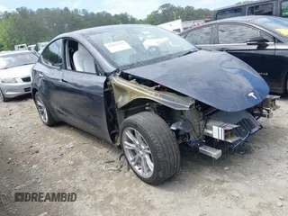 2023 Tesla Model Y Long Range with VIN 7SAYGDEE1PA166355, listed as a IAAI auction lot 42162227 with 11,040 mi miles and . Bid and sale history available at DreamBid. Image 1.