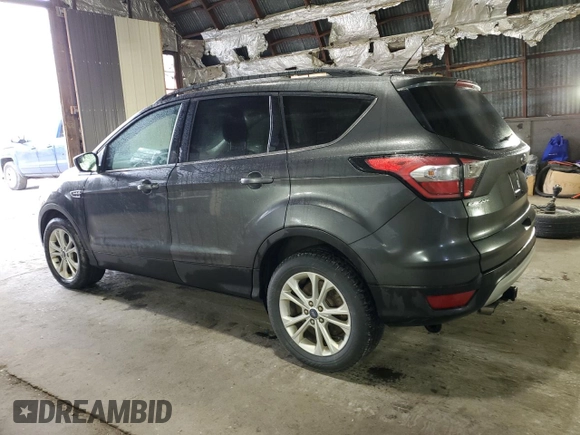 2018 Ford Escape SE z VIN 1FMCU9GD7JUA68705, wystawiony jako Copart lot #58275145 z przebiegiem 200 695 mil mil oraz Tytuł czysty. Historia ofert i sprzedaży dostępna na DreamBid. Obrazek 2.