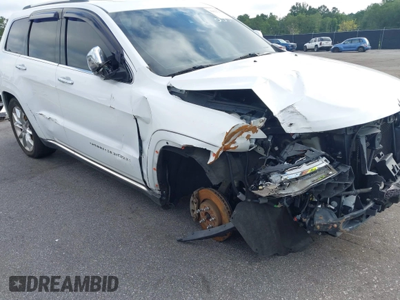 2014 Jeep Grand Cherokee Summit with VIN 1C4RJFJT2EC501235, listed as a IAAI auction lot 42622790 with 160,000 mi miles and . Bid and sale history available at DreamBid. Image 6.
