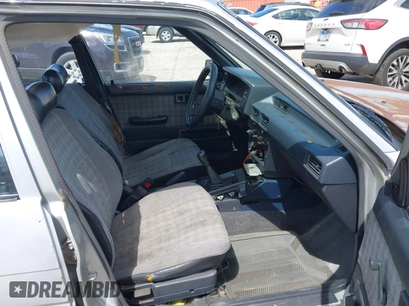 1986 Toyota Corolla with VIN JT2AE82E7G3318230, listed as a IAAI auction lot 42042219 with 74,689 mi miles and . Bid and sale history available at DreamBid. Image 5.