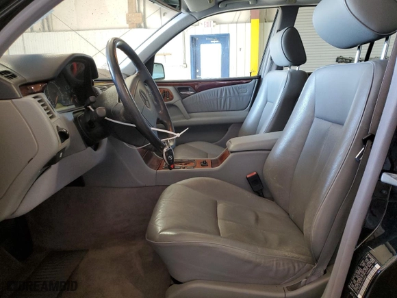 1999 Mercedes-Benz E-Class with VIN WDBJF65H1XA746402, listed as a Copart auction lot 48303385 with 156,461 mi miles and Salvage Title. Bid and sale history available at carsss.com. Image 7.