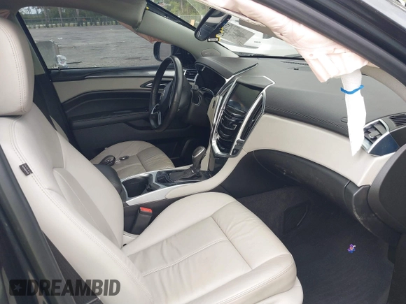 2015 Cadillac SRX with VIN 3GYFNAE30FS569009, listed as a IAAI auction lot 41718522 with 104,448 mi miles and . Bid and sale history available at DreamBid. Image 5.