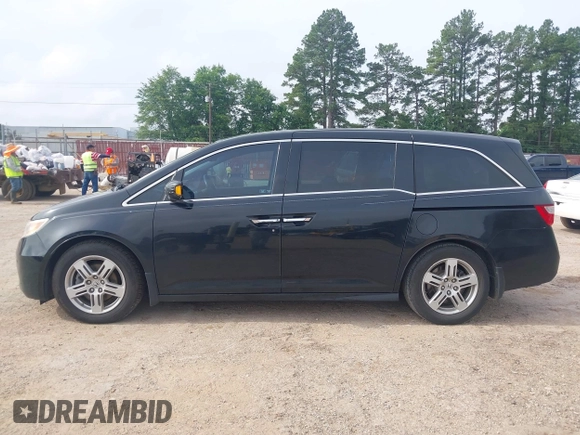 2011 Honda Odyssey Touring with VIN 5FNRL5H90BB070472, listed as a IAAI auction lot 42367710 with 203,589 mi miles and . Bid and sale history available at DreamBid. Image 14.
