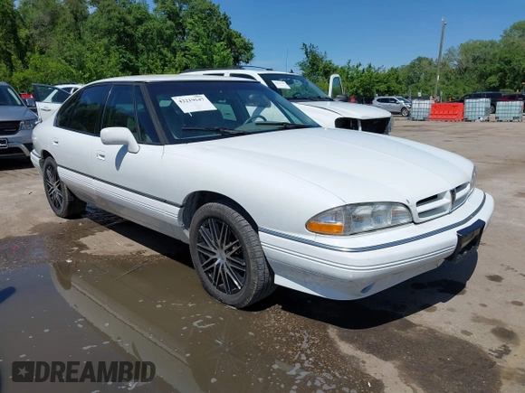 1993 Pontiac Bonneville SE z VIN 1G2HX53L8P1281104, wystawiony jako IAAI lot #42219547 z przebiegiem 113 292 mil mil oraz . Historia ofert i sprzedaży dostępna na DreamBid. Obrazek 1.