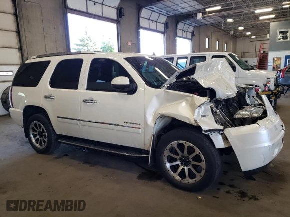 2012 GMC Yukon Denali with VIN 1GKS2EEF3CR140772, listed as a Copart auction lot 69621614 with 207,425 mi miles and Salvage Title. Bid and sale history available at carsss.com. Image 4.