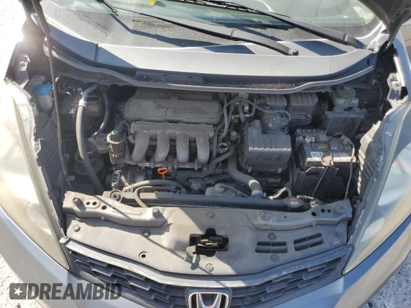 2013 Honda Fit Sport z VIN JHMGE8H53DC026920, wystawiony jako Copart lot #58505615 z przebiegiem 132 286 mil mil oraz Szkoda całkowita • Salvage title. Historia ofert i sprzedaży dostępna na DreamBid. Obrazek 11.