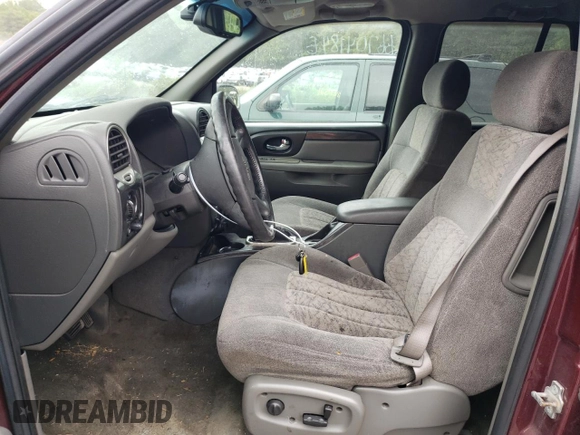 2004 GMC Envoy SLT with VIN 1GKDT13S342336784, listed as a Copart auction lot 66704184 with 169,431 mi miles and Salvage Title. Bid and sale history available at DreamBid. Image 7.