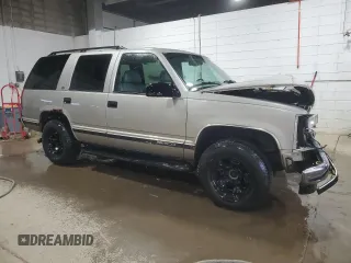 1999 GMC Yukon with VIN 1GKEK13R1XJ740648, listed as a Copart auction lot 82829084 with 211,002 mi miles and Salvage Title. Bid and sale history available at carsss.com. Image 4.