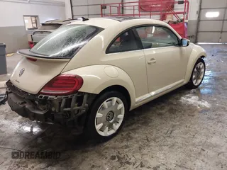 2019 Volkswagen Beetle S with VIN 3VWFD7ATXKM705322, listed as a IAAI auction lot 41409600 with 97,479 mi miles. Bid and sale history available at carsss.com. Image 4.